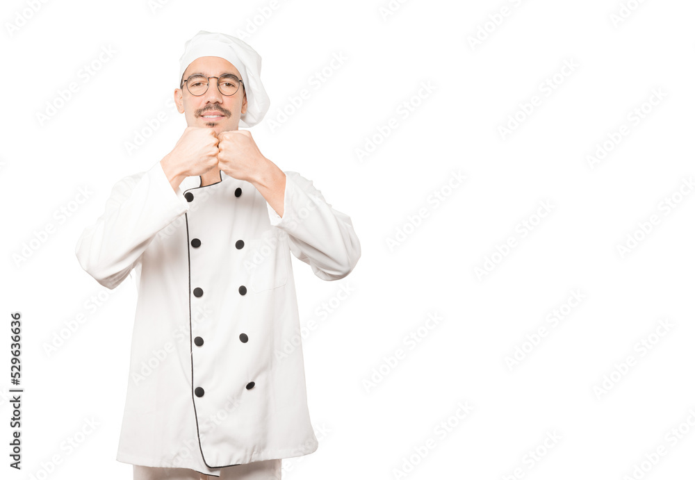 Young chef making a gesture of team work with his hands Young chef making a gesture of team work with his hands