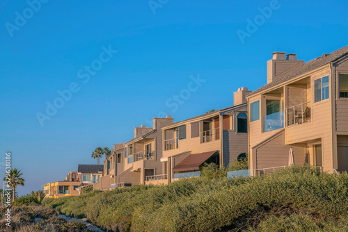 Homes on cliff overlooking beach at Del Mar Southern California on a sunny day