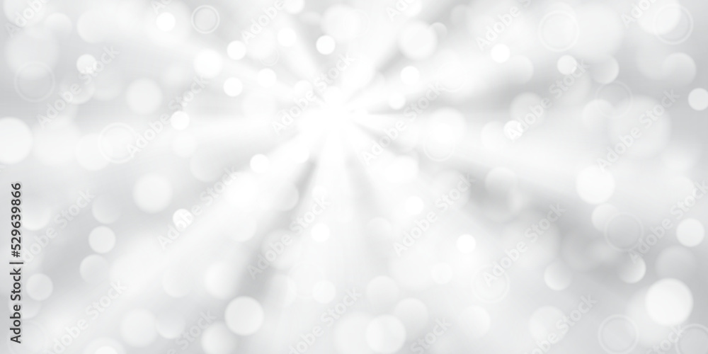 Abstract background in white and gray colors with diverging rays of light and small translucent circles with bokeh effect Abstract background in white and gray colors with diverging rays of light and small translucent circles with bokeh effect