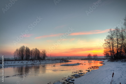 Winter landscape, amazing sundown in winter , Poland Europe, river