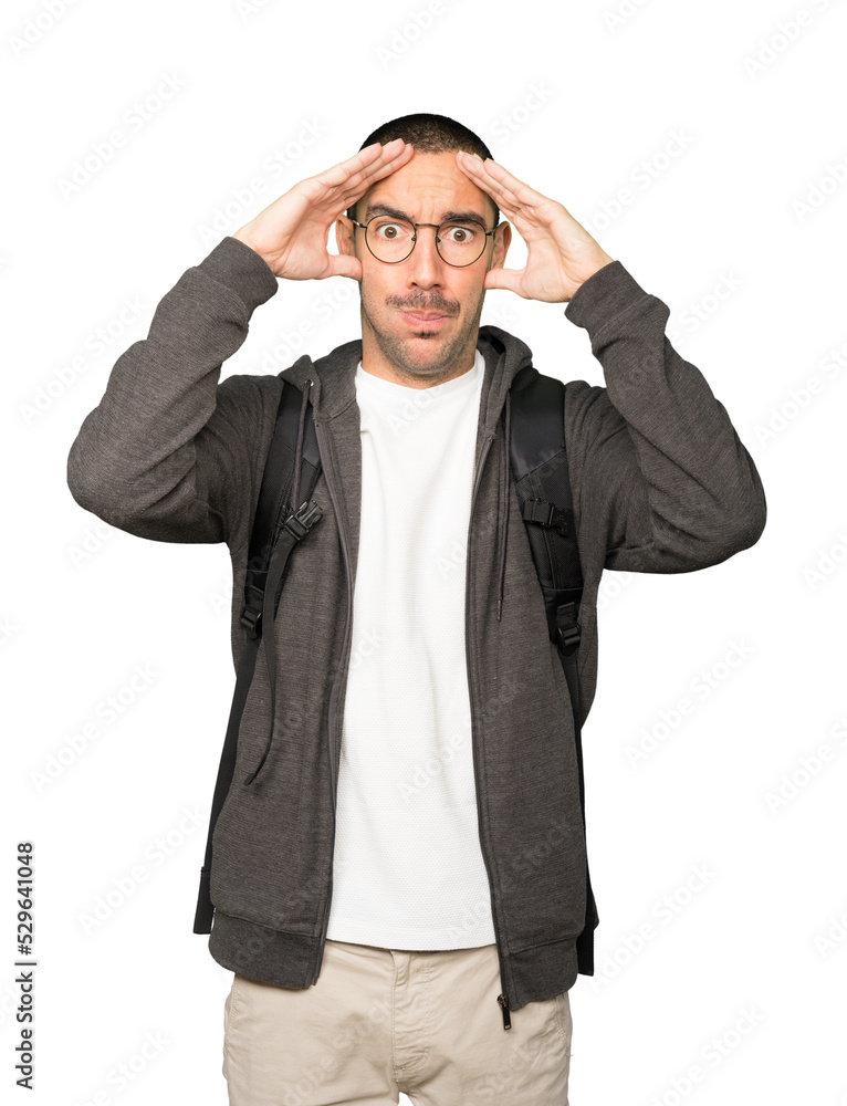 Depressed student posing against background Depressed student posing against background