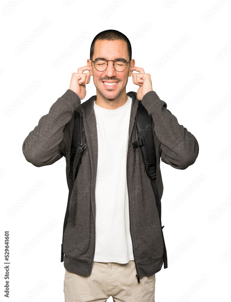 Student worried about loud noises and covering his ears Student worried about loud noises and covering his ears
