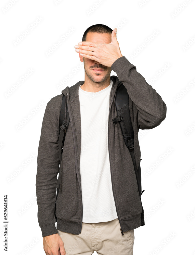 Student covering his eyes with his hands Student covering his eyes with his hands