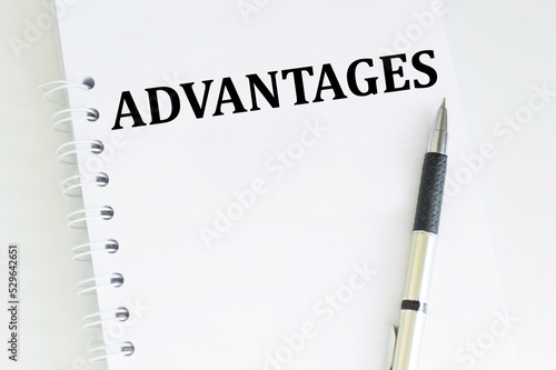 ADVANTAGES text on white page blonde on a light background, business and finance