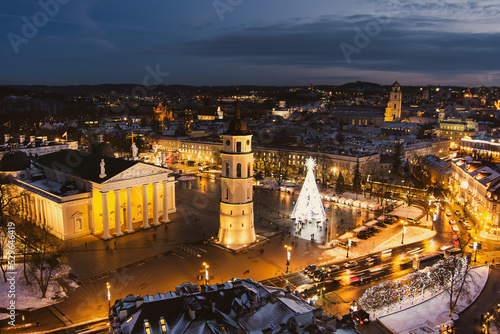 Beautiful aerial view of decorated and illuminated Christmas tree on the Cathedral Square at night in Vilnius, Lithuania.