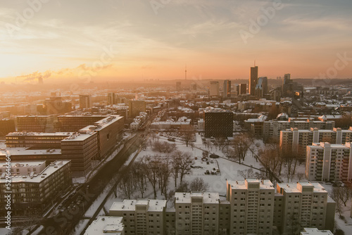 Beautiful Vilnius city panorama in winter with snow covered houses, churches and streets. Aerial evening view. Winter city scenery in Lithuania.