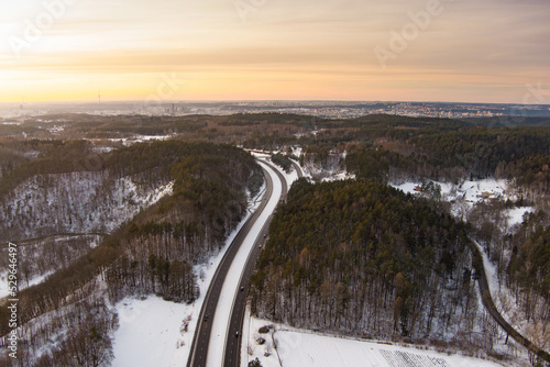 Beautiful aerial view of snow covered pine forests. Rime ice and hoar frost covering trees. Scenic landscape near Vilnius, Lithuania.