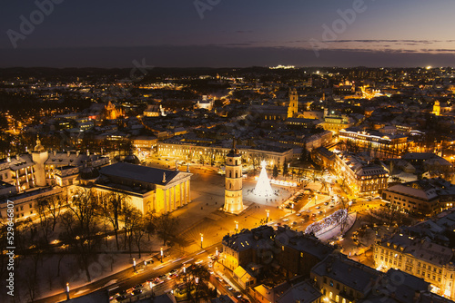 Beautiful aerial view of decorated and illuminated Christmas tree on the Cathedral Square at night in Vilnius, Lithuania.