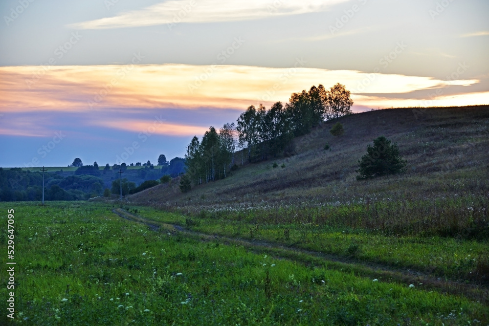 The right slope of the Shakva river valley at sunset