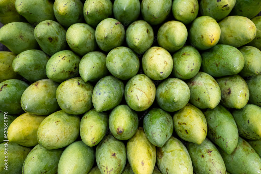 Freshness green mango arrange neatly on the fruit stall in supermarket