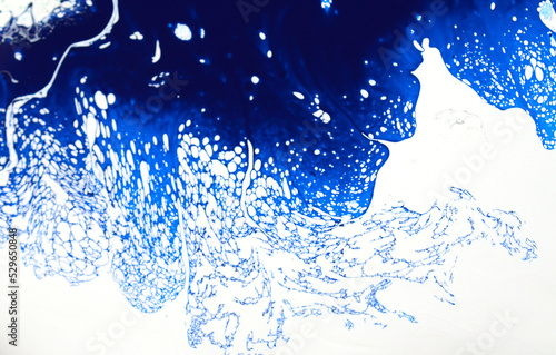 Luxury abstract fluid art painting background. Spilled blue, white and gold acrylic paint