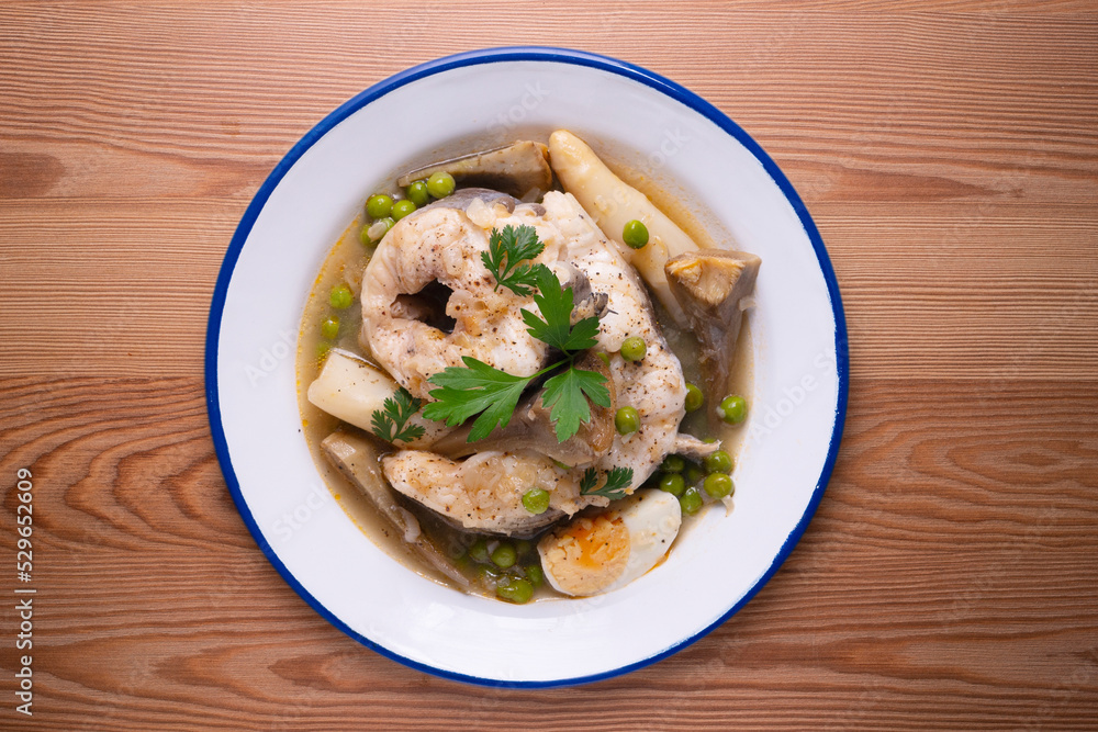 Conger eel with white asparagus and egg. Traditional Spanish tapas from a fishing village. Conger eel with white asparagus and egg. Traditional Spanish tapas from a fishing village.