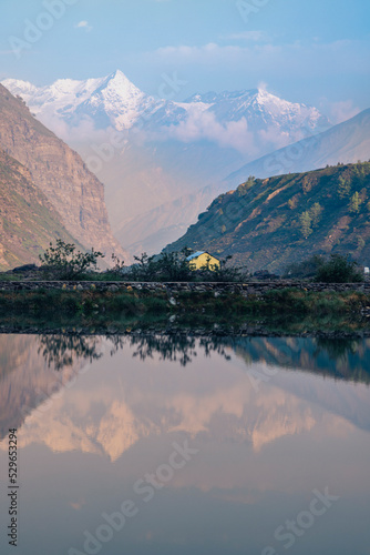 Landscape view of snow-capped mountains with reflection in lake Sissu, in Sissu, Himachal Pradesh India