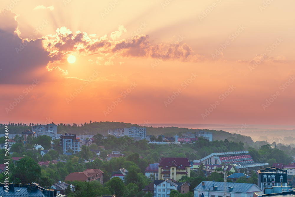 The sun rises over the city Truskavets, Ukraine. Summertime.