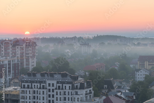 The sun rises over the city Truskavets, Ukraine. Summertime.