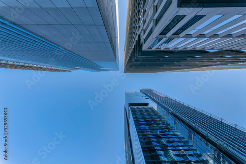 Looking up from the street at buildings and clear blue sky in Austin Texas