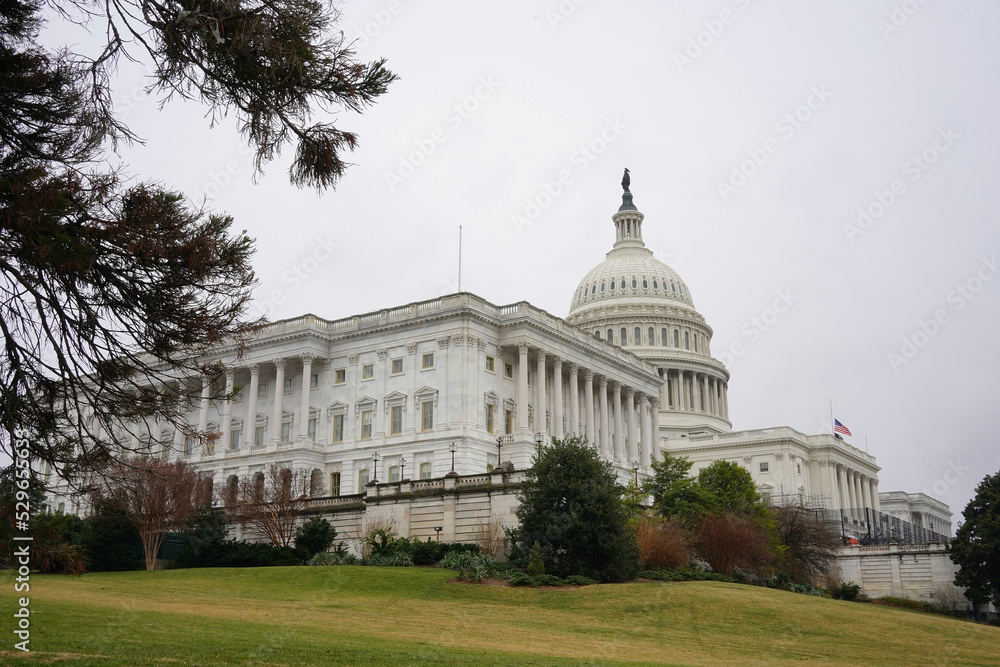 View of the senate capitol building in Washington DC during cloudy day in winter 2022. View from National mall 