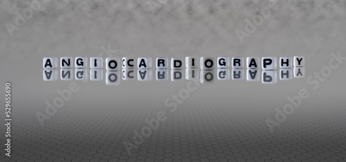 angiocardiography word or concept represented by black and white letter cubes on a grey horizon background stretching to infinity