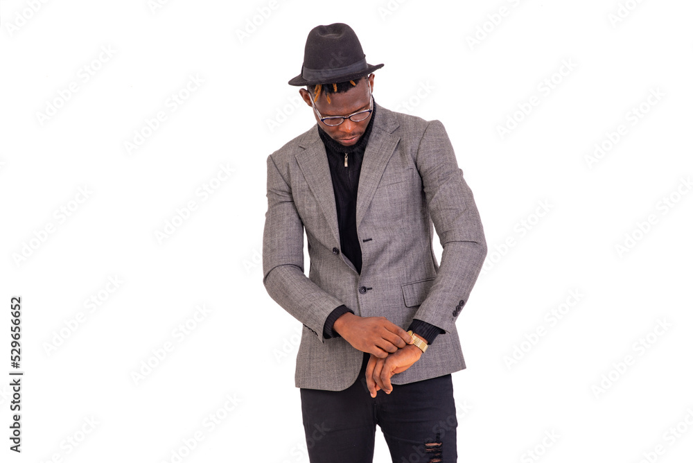 young business man looking at the time on his wrist watch. young business man looking at the time on his wrist watch.
