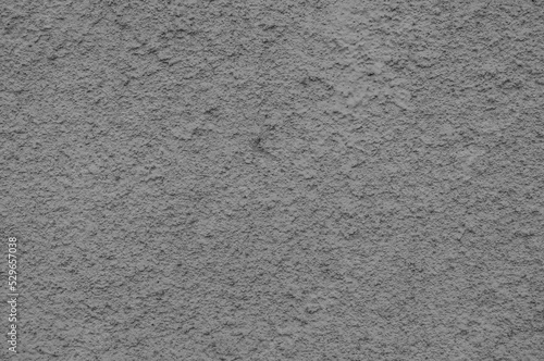 Gray concrete stucco wall, uneven grungy vintage background close-up, grunge texture.