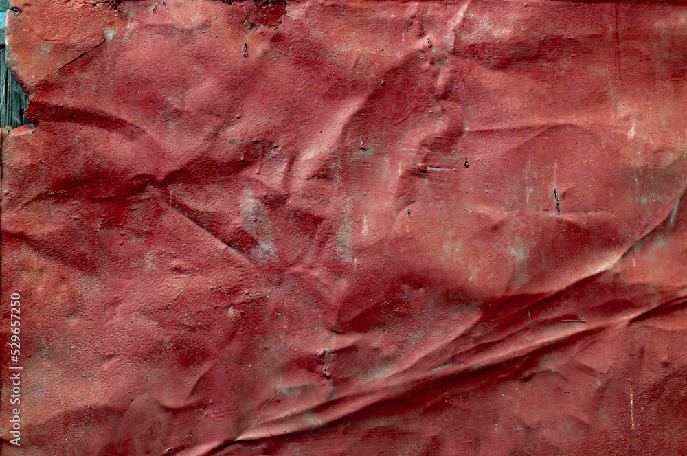 Old crumpled metal sheet, faded red paint covered with dust and dirt, grungy textured surface, closeup vintage background Old crumpled metal sheet, faded red paint covered with dust and dirt, grungy textured surface, closeup vintage background