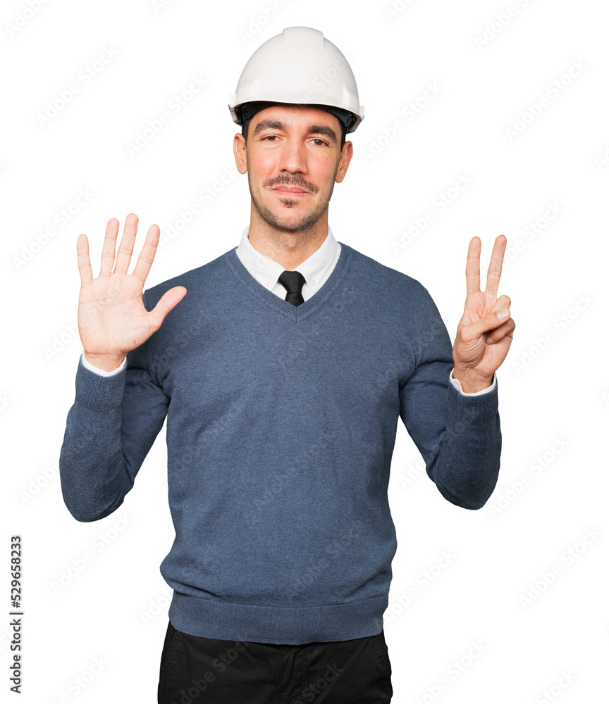 Young architect making a gesture of number seven