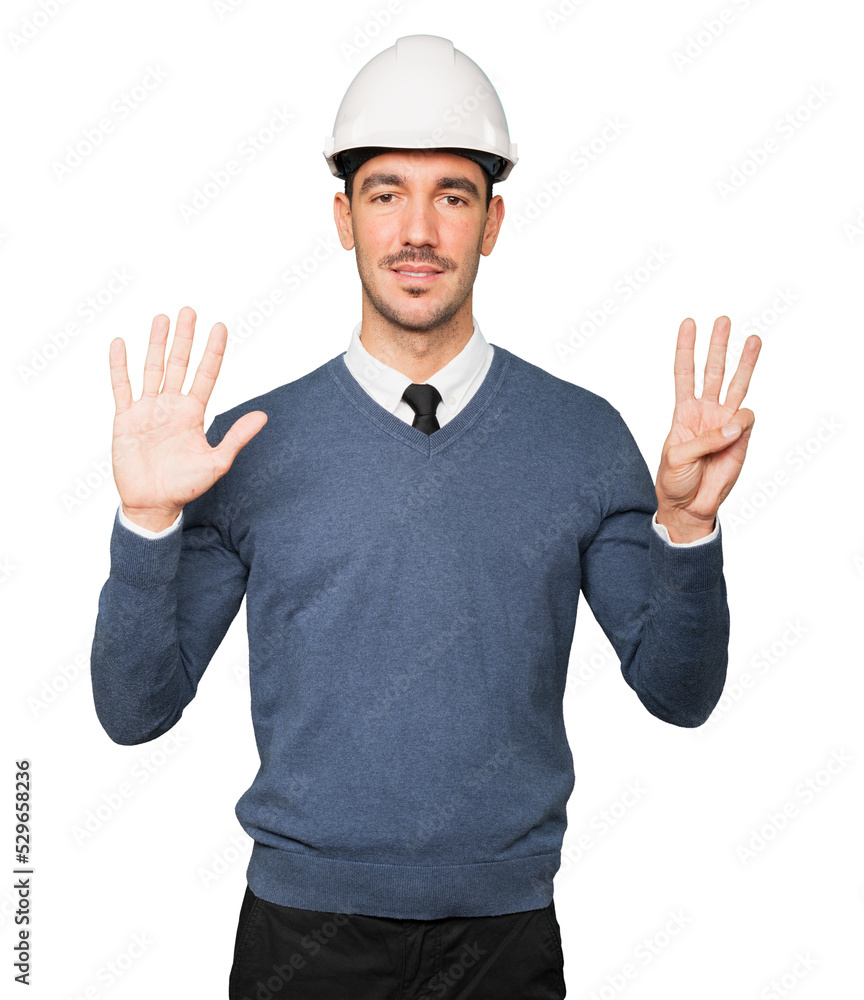 Young architect making a gesture of number eight Young architect making a gesture of number eight