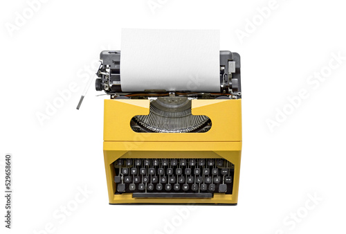 Vintage typewriter with a blank white sheet of paper isolated