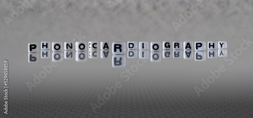 phonocardiography word or concept represented by black and white letter cubes on a grey horizon background stretching to infinity