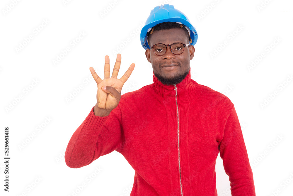 young man engineer showing four fingers. young man engineer showing four fingers.