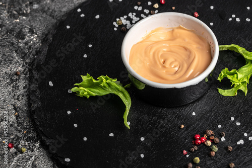 Thousand Islands sauce, American cuisine, dip for burgers and meat. on a dark background, Food recipe background. Close up