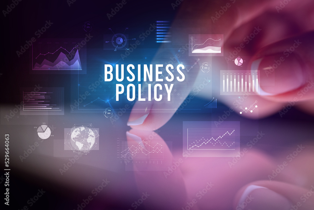 Finger touching tablet with business graphs and icons concept Finger touching tablet with business graphs and icons concept