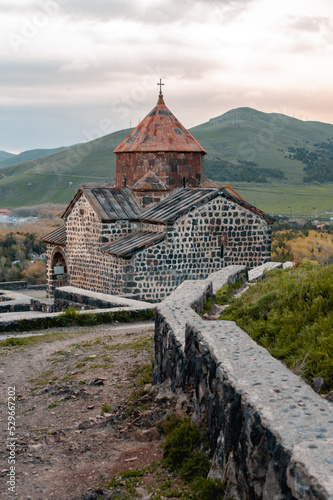 An ancient Christian monastery built of stone many centuries ago. Sevanavank monastery in Armenia on Lake Sevan. Concept of world religions and ancient culture