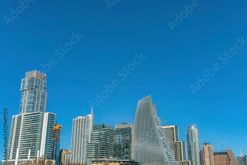 Scenic skyline in Austin Texas with exterior view of modern luxury apartments © Jason