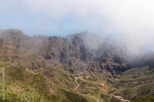 Scenic view on the steep canyon of the Teno mountain massif, Tenerife, Canary Islands, Spain, Europe. Hiking trail between village Masca and Santiago del Teide. View from Cruz de Gala. Clouds coming © Chris