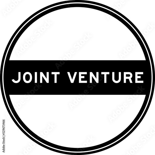 Black color round seal sticker in word joint venture on white background