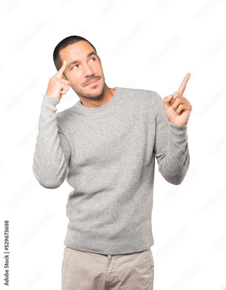 Surprised young man doing a gesture of concentration Surprised young man doing a gesture of concentration