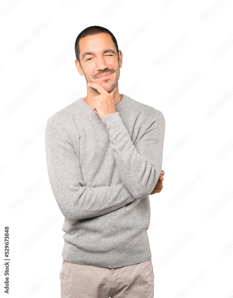 Friendly young man winking an eye Friendly young man winking an eye
