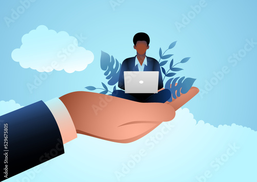 Giant hand holding a black businessman who works on laptop