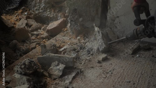 Wallpaper Mural Worker drilling concrete on construction site. Using drill on demolition site Torontodigital.ca