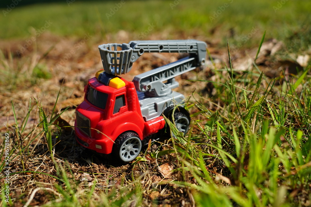 Young child's toy truck set sitting outside. Young child's toy truck set sitting outside.