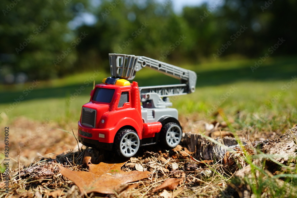 Young child's toy truck set sitting outside. Young child's toy truck set sitting outside.