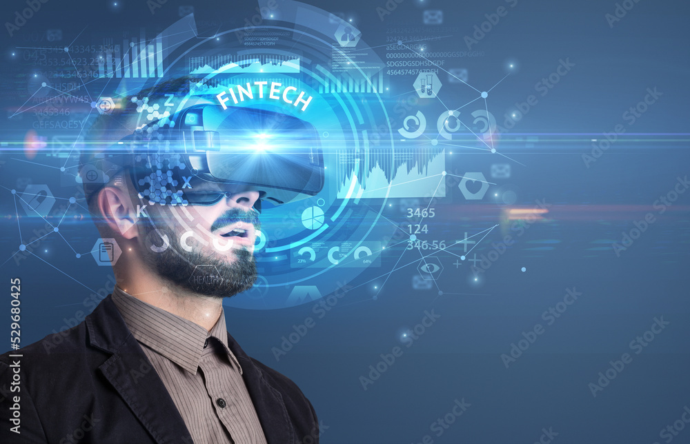 Obraz premium Businessman looking through VR glasses