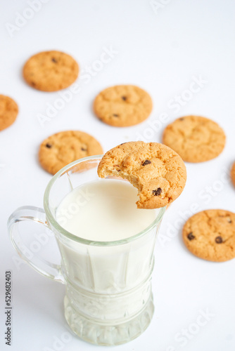 A glass of milk with delicious cookies