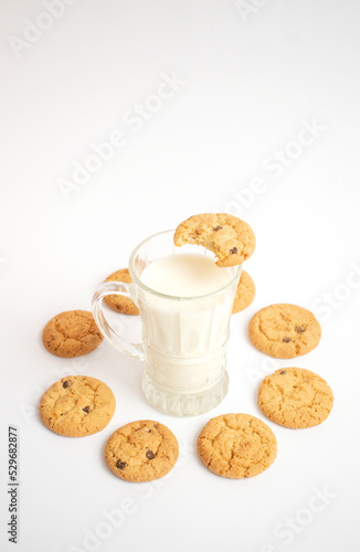 A glass of milk with delicious cookies

