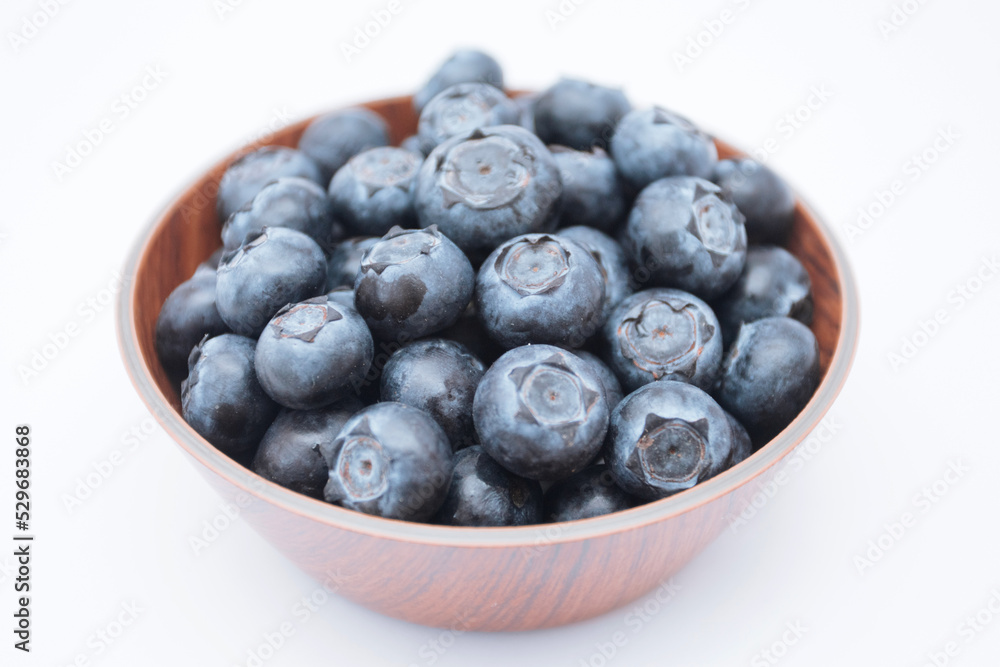 Fresh Blueberries in a bowl on white background Fresh Blueberries in a bowl on white background