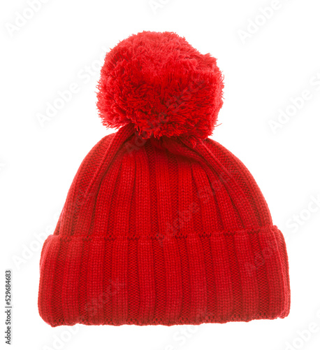 Red knitted winter bobble hat of traditional design isolated on white background. Handmade woolly cap with pompom on top