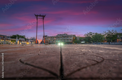 Giant Swing, Landmark, Bangkok, Thailand at dusk after sunset car lights shine photo