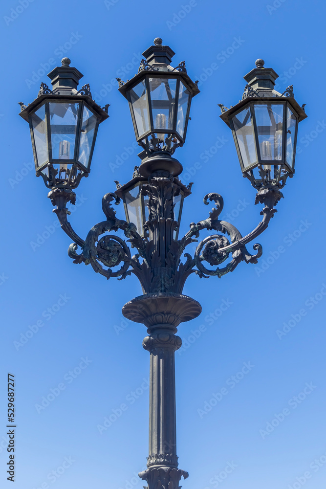 vintage street lamp on a blue sky background