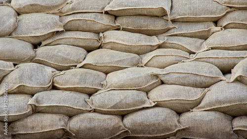 Sandbag flood protection barricade wall Background texture.